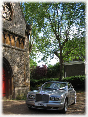 Bentley wedding car outside a church